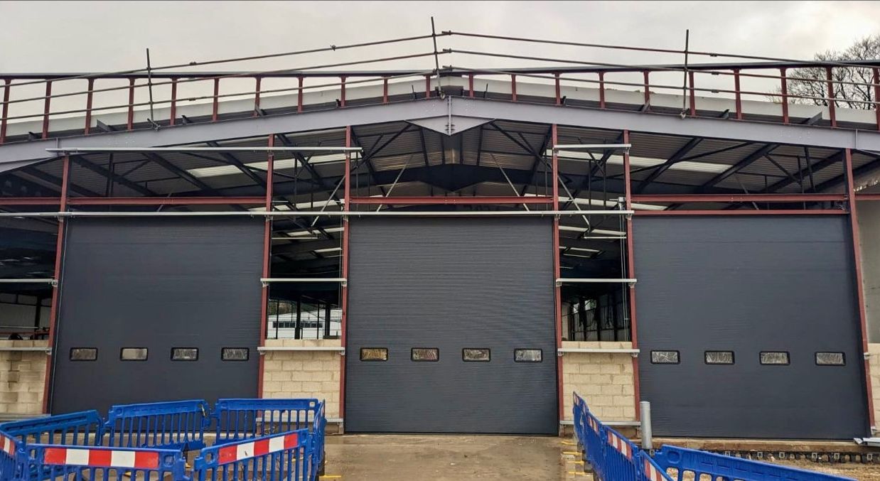 NextGen Industrial Doors - Design, supply, and installation of three ISO 40 Insulated Sectional Overhead Doors in Dunstable, UK.